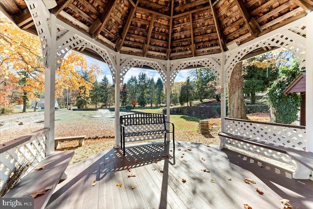 wooden terrace featuring a gazebo