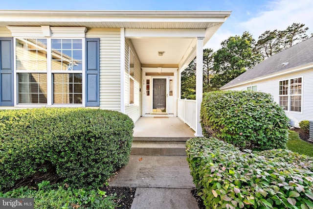 property entrance with covered porch