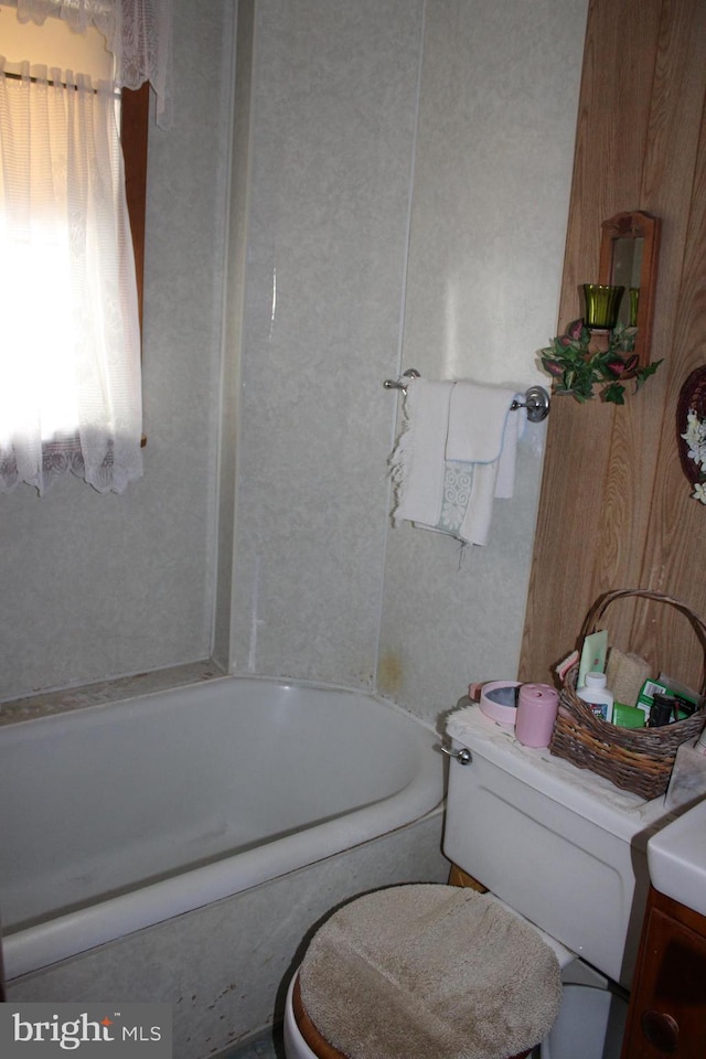 bathroom with a bathtub and toilet