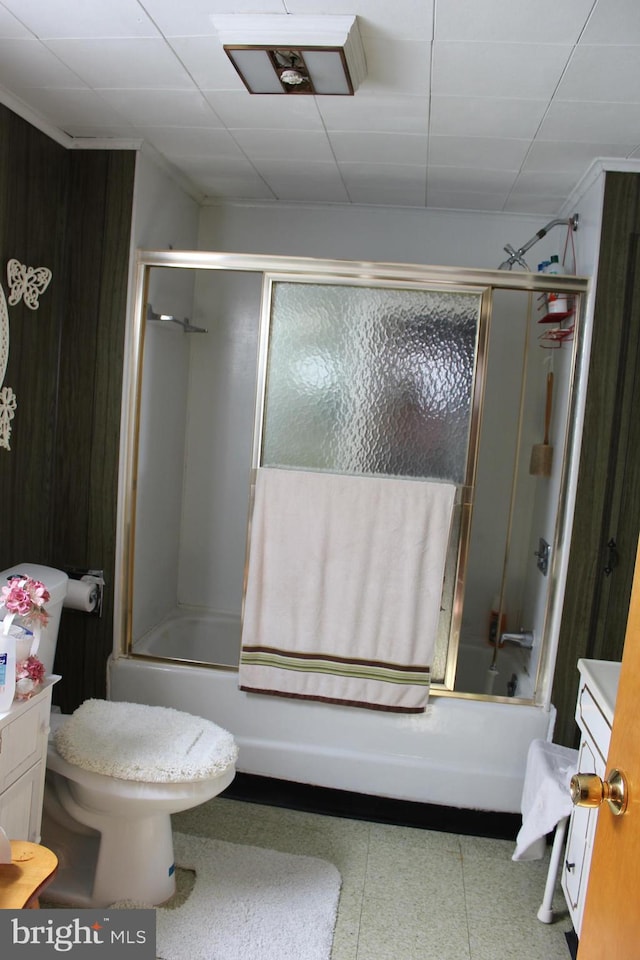 full bathroom with vanity, toilet, and bath / shower combo with glass door