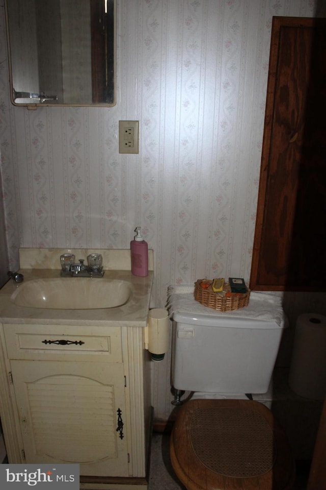 bathroom with vanity and toilet