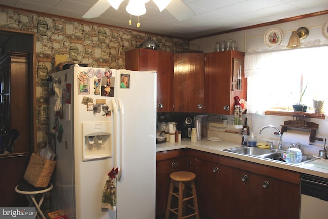 kitchen featuring white appliances and sink