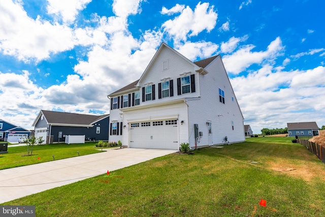 view of front of property with a front lawn and a garage