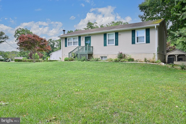 view of front of property with central AC and a front lawn