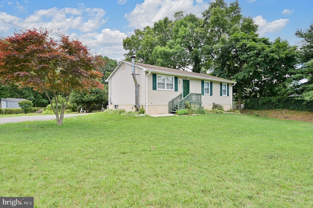 view of front of home with a front yard