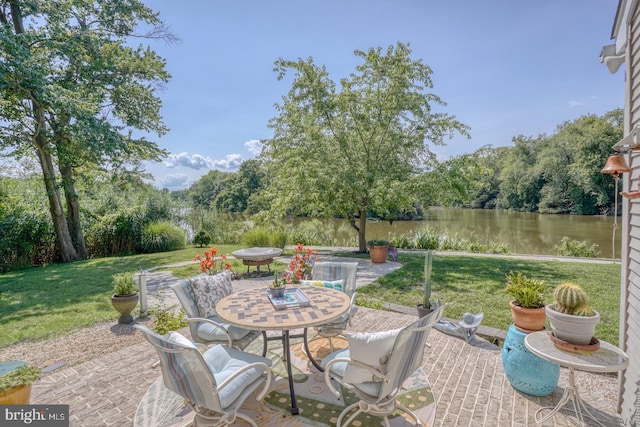 view of patio with a water view