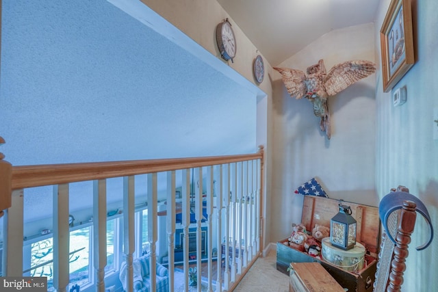 hallway with vaulted ceiling