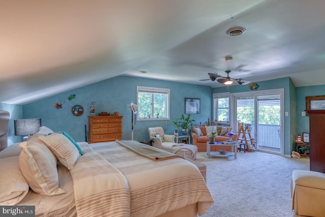 bedroom featuring ceiling fan, vaulted ceiling, multiple windows, and access to outside