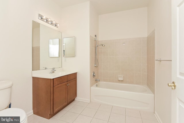 full bathroom with tile patterned flooring, vanity, toilet, and tiled shower / bath