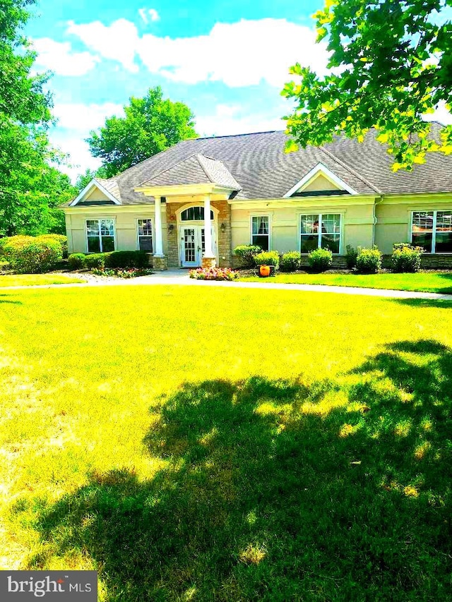 ranch-style house with a front yard