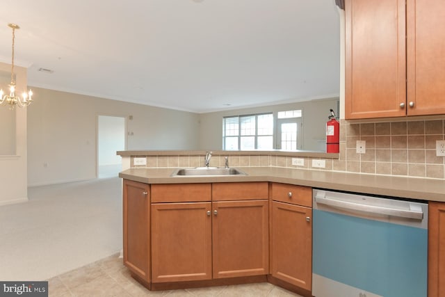 kitchen with decorative backsplash, stainless steel dishwasher, crown molding, sink, and a chandelier