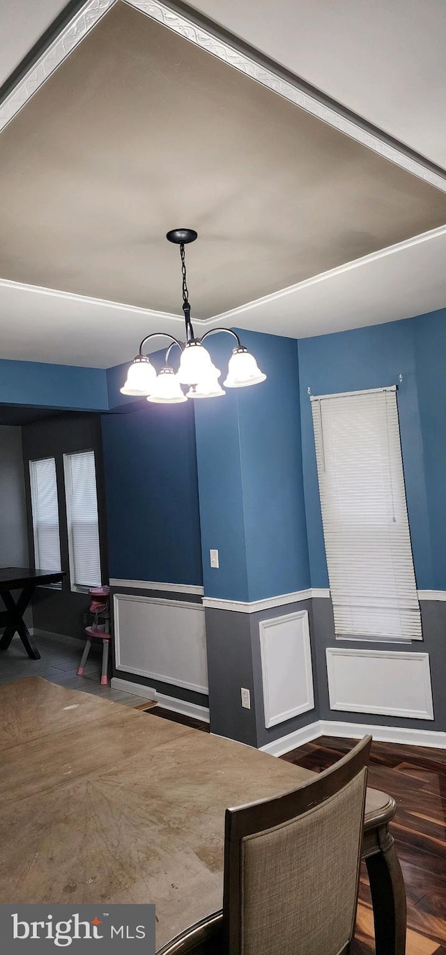 dining space featuring a notable chandelier