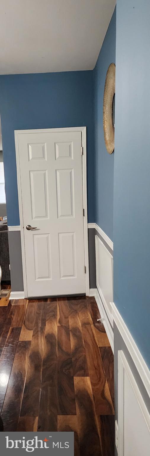 entrance foyer with dark hardwood / wood-style floors