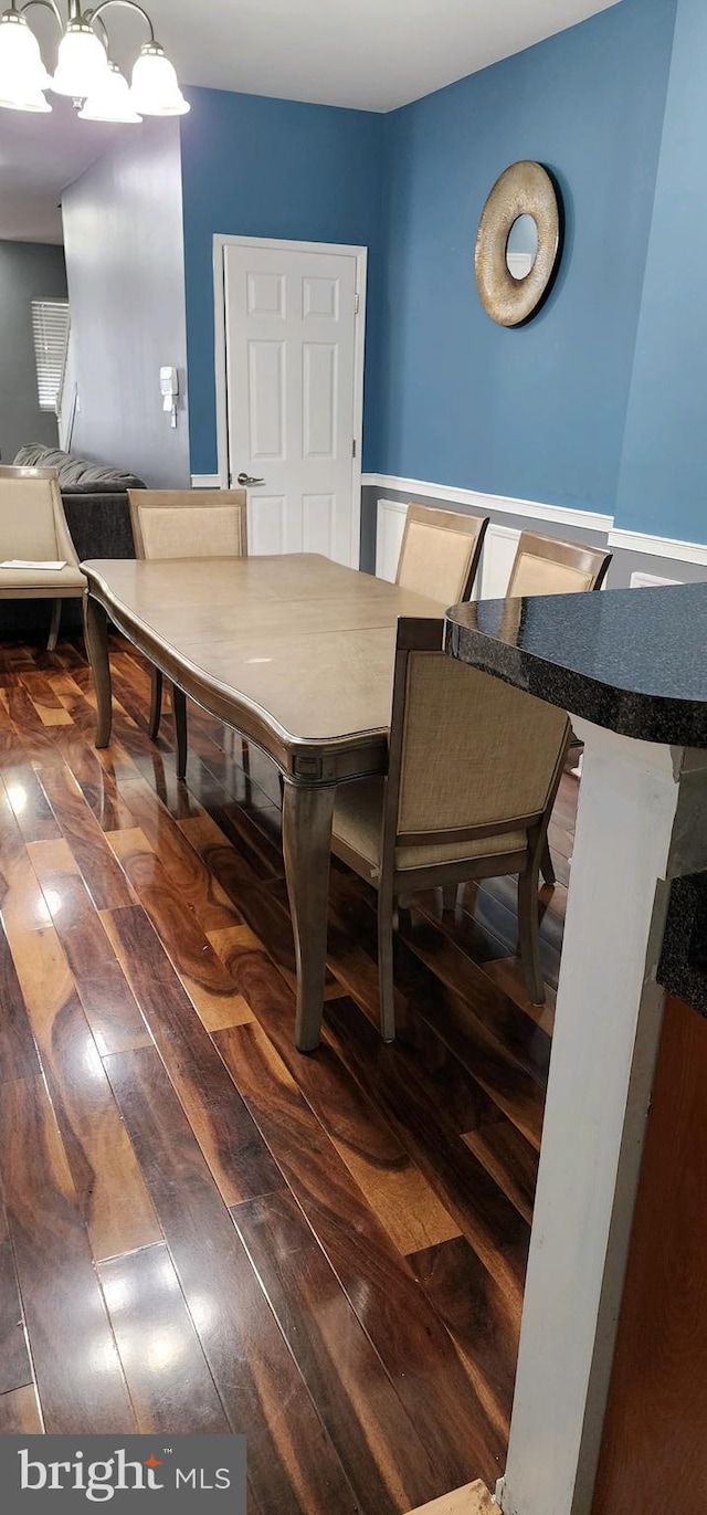 dining area featuring dark hardwood / wood-style floors