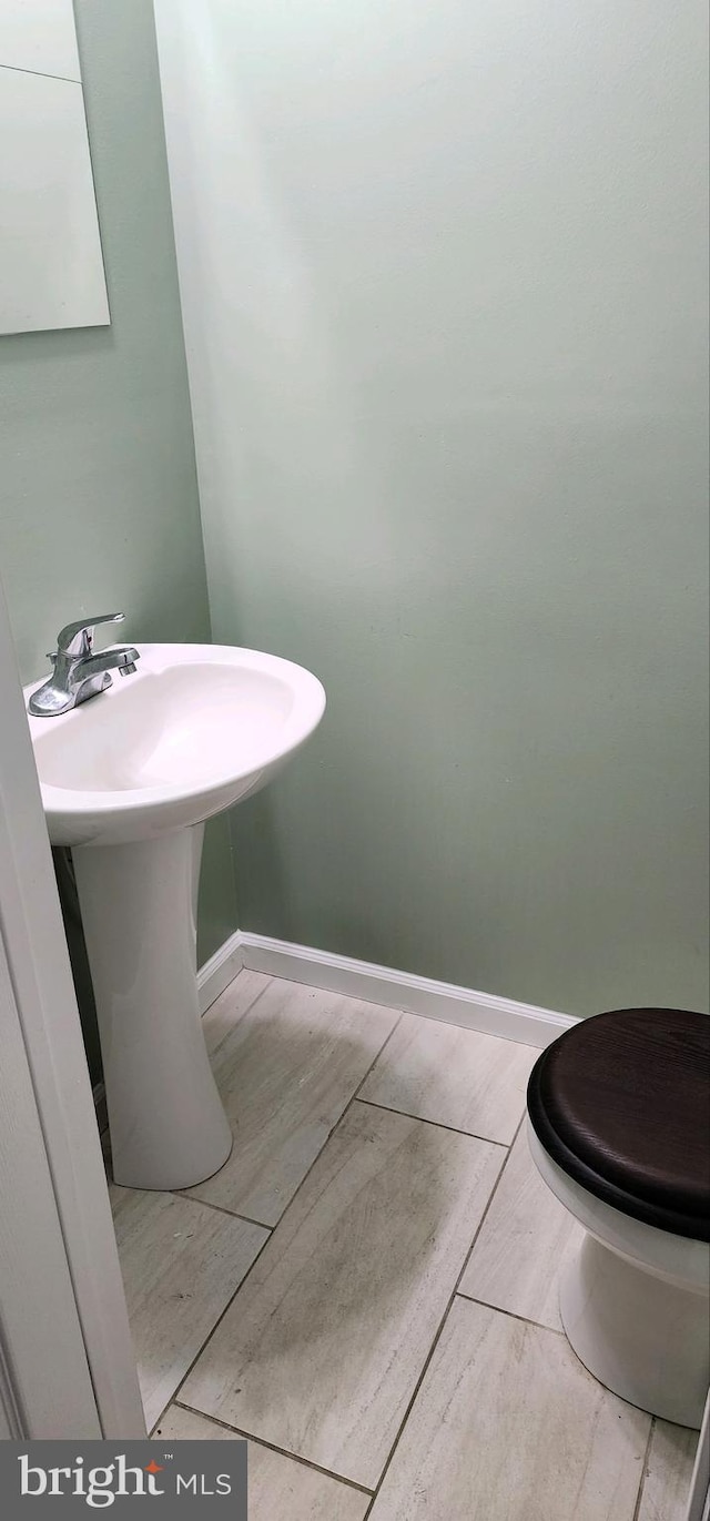 bathroom featuring toilet