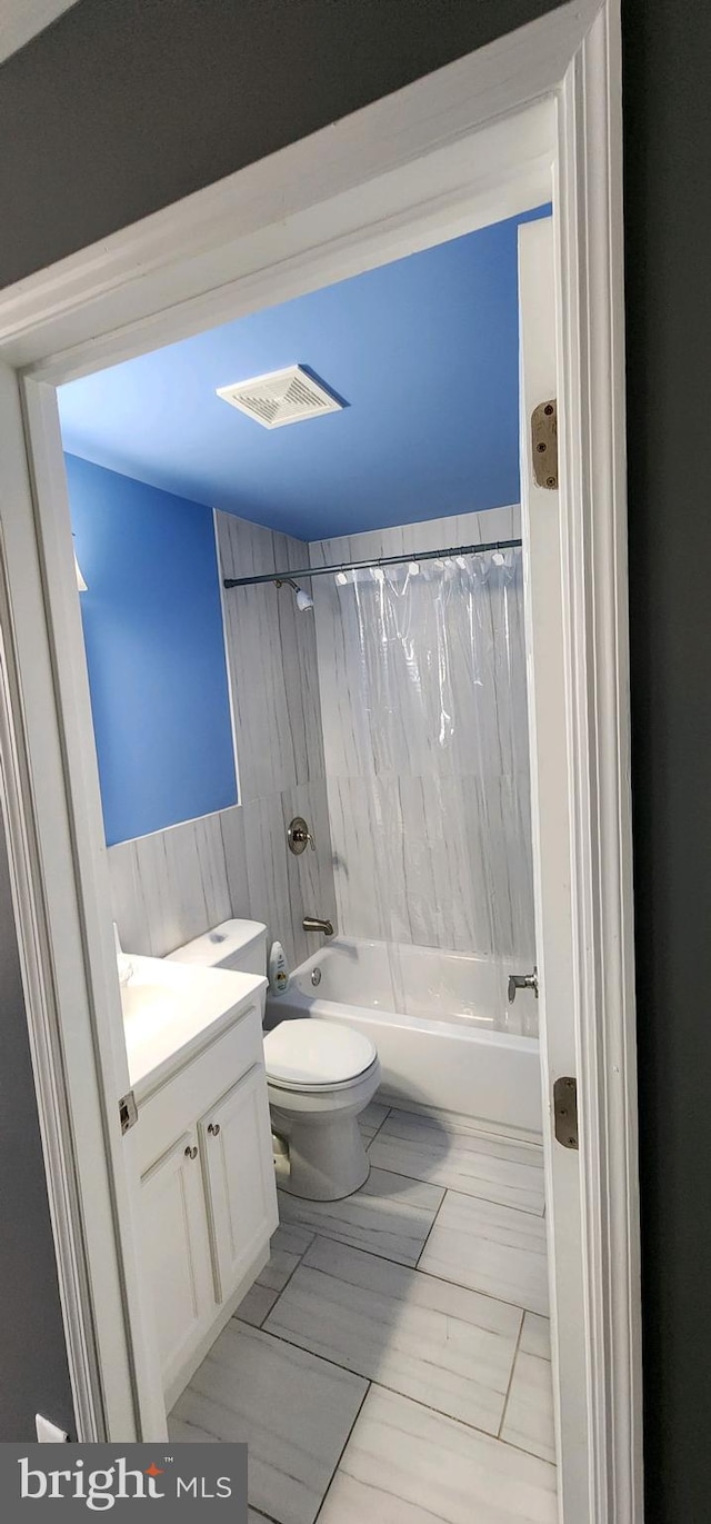 full bathroom featuring vanity, toilet, and bathing tub / shower combination