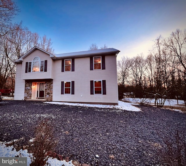 view of front of house with stone siding