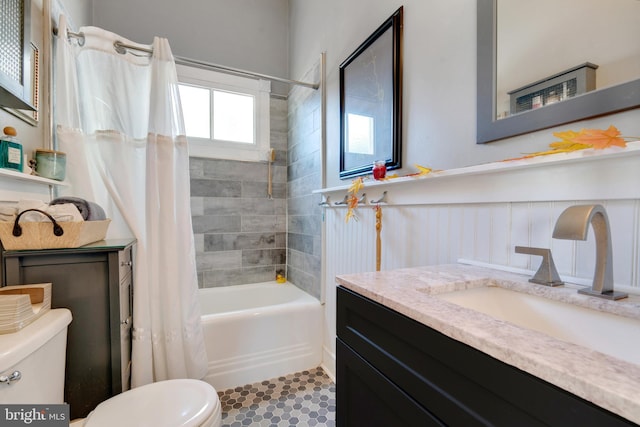 full bathroom with tile patterned flooring, vanity, shower / tub combo, and toilet