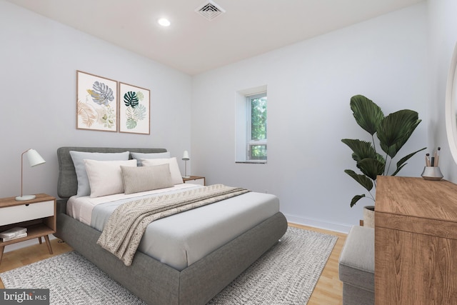 bedroom with hardwood / wood-style floors