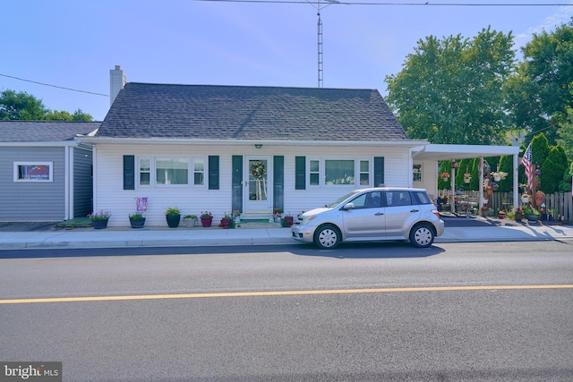 view of front of home with a carport