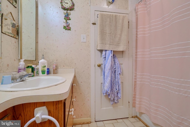 bathroom with tile patterned floors, curtained shower, and vanity