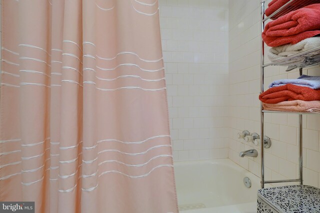 bathroom featuring shower / bath combination with curtain