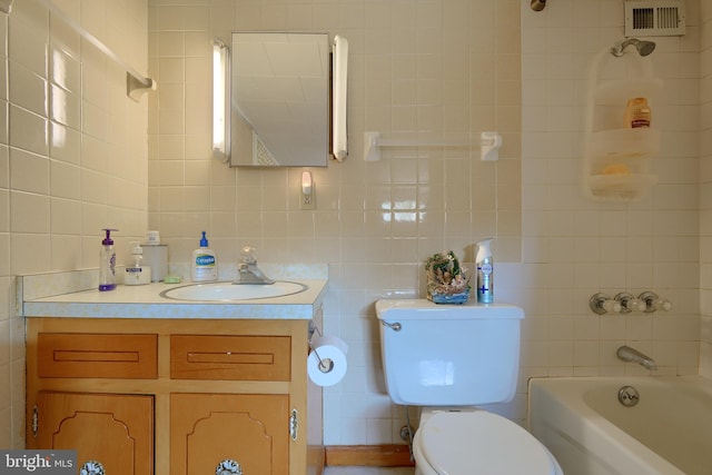 full bathroom with tasteful backsplash, tub / shower combination, toilet, vanity, and tile walls