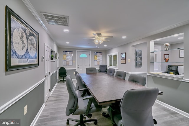 home office with ceiling fan, light hardwood / wood-style floors, and ornamental molding