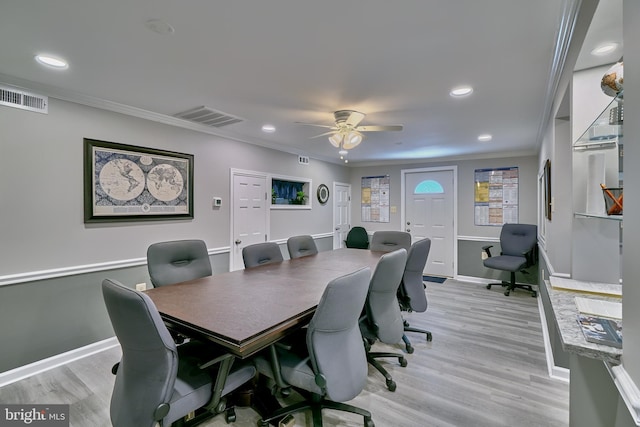 office space with ceiling fan, light wood-type flooring, and crown molding