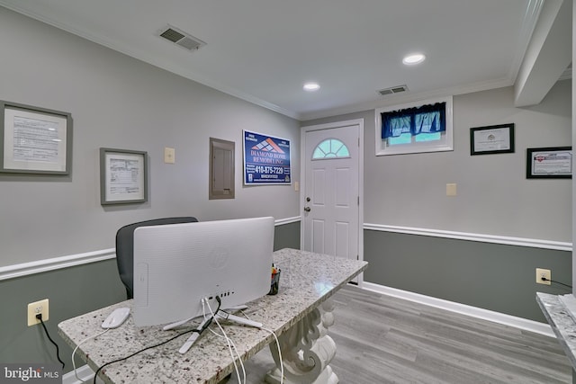 office area with electric panel, crown molding, and hardwood / wood-style floors