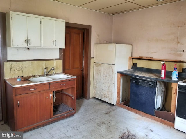 kitchen featuring sink, white appliances, and white cabinets