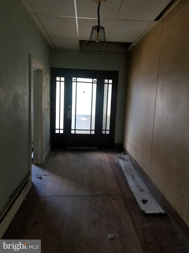 foyer featuring a paneled ceiling and wood-type flooring