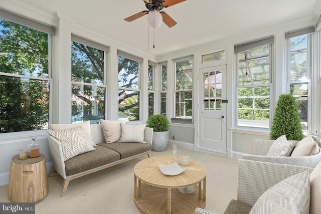 sunroom featuring ceiling fan and a wealth of natural light