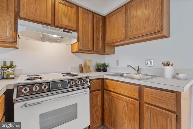 kitchen with sink and white electric range