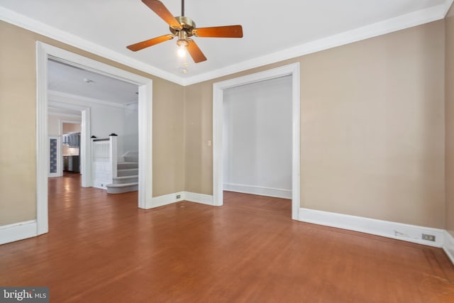 empty room with ornamental molding, hardwood / wood-style flooring, and ceiling fan