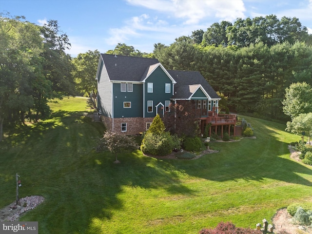 exterior space with a yard and a wooden deck