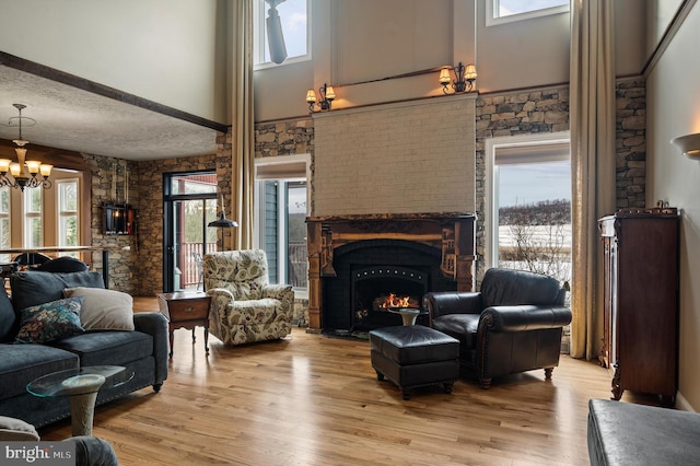 living room featuring plenty of natural light and light hardwood / wood-style flooring