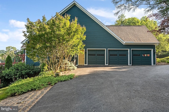 view of front of home with a garage