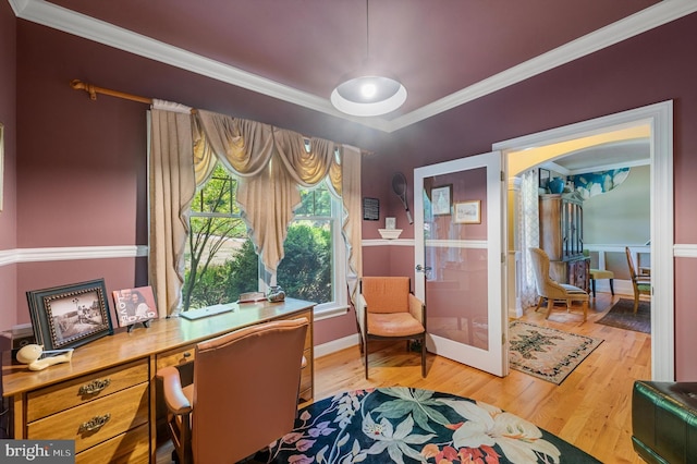 office featuring hardwood / wood-style flooring, french doors, and crown molding