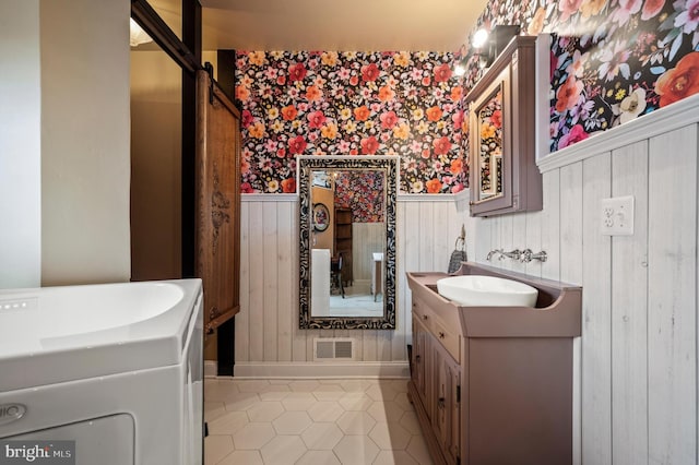 bathroom with tile patterned floors and vanity