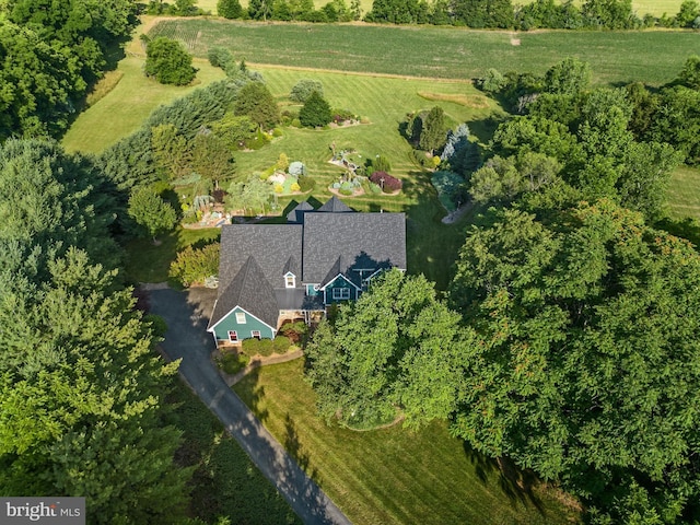 birds eye view of property with a rural view