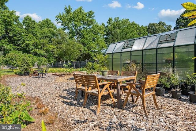 view of patio featuring an outbuilding