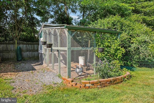 view of outbuilding with a yard