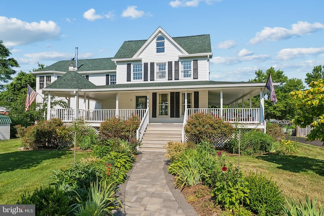 country-style home with covered porch and a front lawn