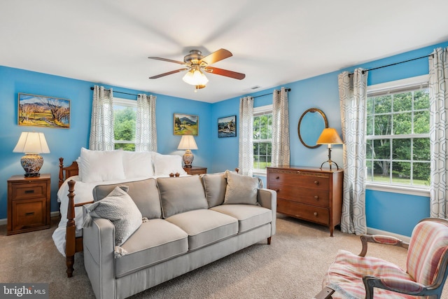 bedroom featuring baseboards, visible vents, carpet flooring, and a ceiling fan