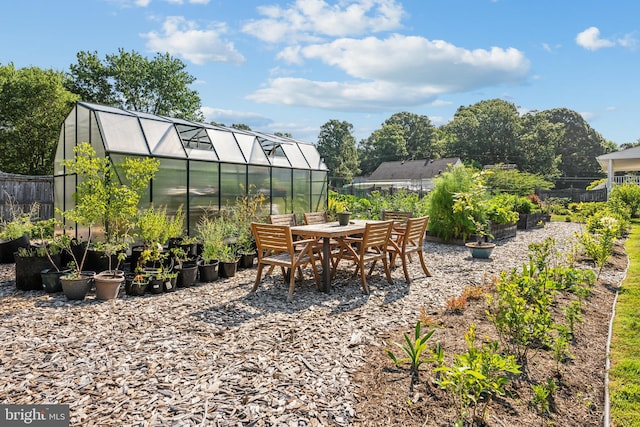 view of patio / terrace with an outbuilding