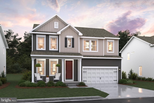 view of front of home featuring a lawn and a garage