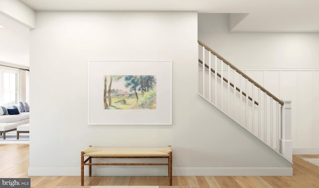 staircase with wood-type flooring