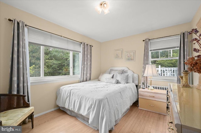 bedroom with light hardwood / wood-style flooring