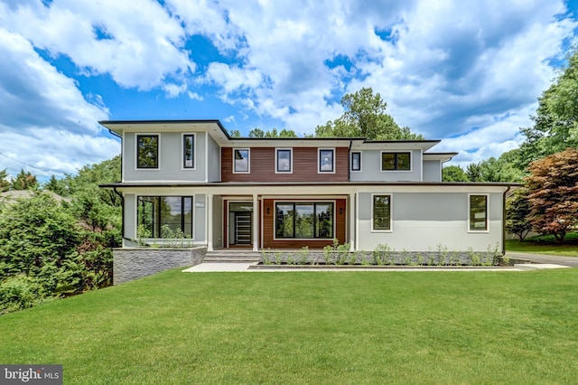 view of front of home featuring a porch and a front lawn